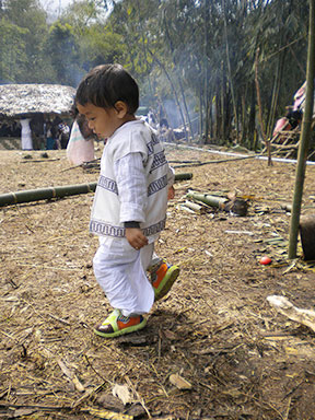 A little Galo boy; since the tribe only has a spoken dialect, the last syllable of the father is used as the first half of the child's name to help in understanding the lineage